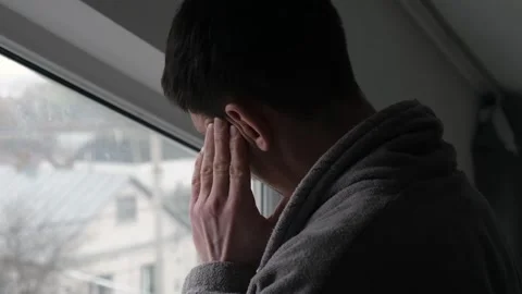 Close-up of man massaging temples while experiencing headache Видео 332055795
