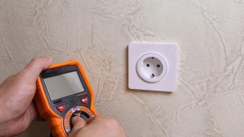 Close-up of man measuring and cheking power supply voltage Stock Footage 93439858