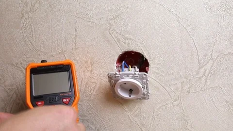 Close-up of man measuring and cheking power supply voltage Stock Footage 93441715