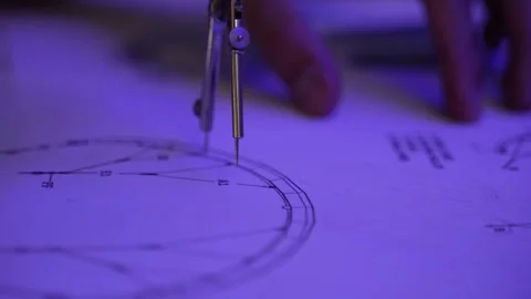 Close up of a man measuring a technical diagram with a compass Video stock 284713715