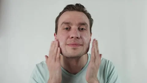 Close up of a man with moisturizer for his face. Skin protectoin Video stock 171750514