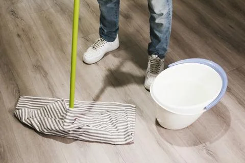 Close up man mopping floor. High quality photo Stock Photos