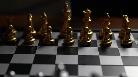 Close up Man moving chess pawn defeat enemy on chessboard Slow motion Stockbeeldmateriaal 106801170