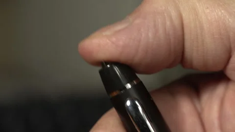 Close up of a man nervously clicking his pen Stock Footage 201962141