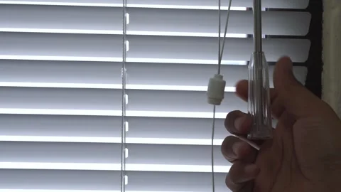 Close Up man opening roller blind shutters on the balcony on a summer day Stock Footage 328646246