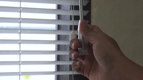 Close Up man opening roller blind shutters on the balcony on a summer day Stock Footage 328646247