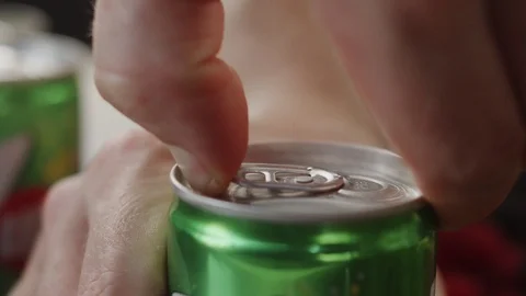 Close-up man opens can of soda with his finger. Slow motion video Stock Footage 123821853