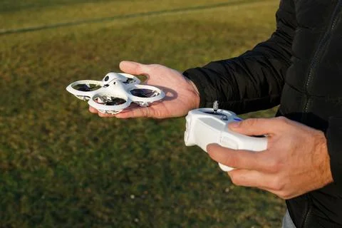 Close-up of a Man Operating a Drone with Remote Control Foto stock
