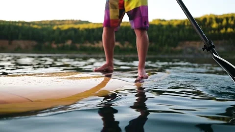 Close up of man paddling on surf board Stock Footage 166466155