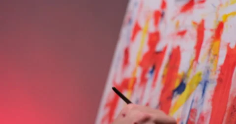 Close up of man painting picture on canvas, camera move Stockbeeldmateriaal 233905853