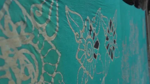 Close up a man paints Batik with a brush Stock Footage 146762001
