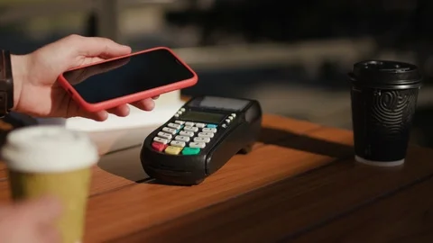 Close up man paying with NFC technology with smart phone credit card application Stock Footage 115505790