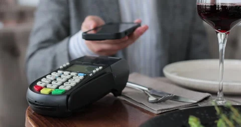 Close up man paying restaurant bill using credit card. Stock Footage 319012782