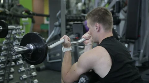 Close-up of a man performs gym exercises Stock Footage 66490073