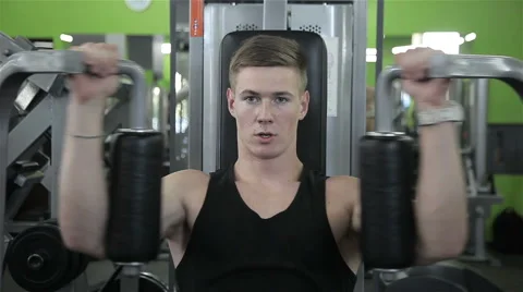 Close-up of a man performs gym exercises Stock Footage 66545323