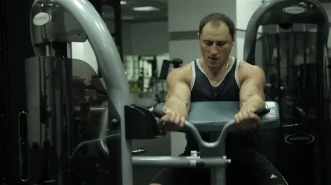 Close-up of a man performs gym exercises Stock Footage 67540875
