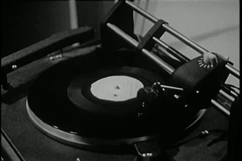 Close-up of man placing needle on record on vintage turntable Stock Footage 11356265