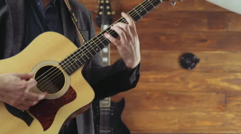 Close up man playing the acoustic guitar slow motion Video stock 59193530
