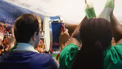 Close up of man playing drum inside football stadium during match day Video stock 337553959