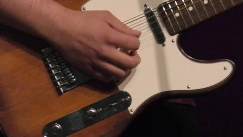 Close up from man playing on a guitar Stock Footage 118777133