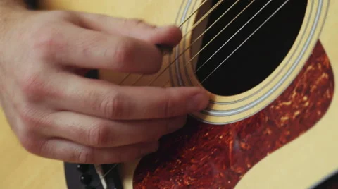Close up man playing the guitar with mediator Stock Footage 59191671