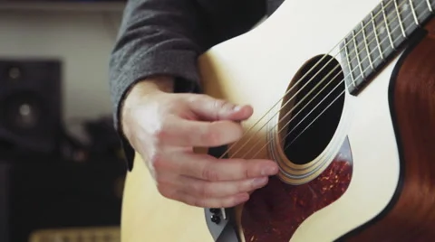 Close up man playing the guitar using mediator Stock Footage 59194022