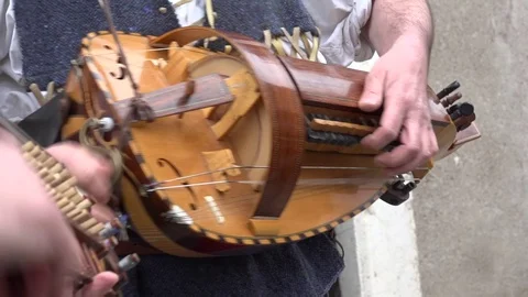 Close up of a man playing the hurdy-gurdy Stock Footage 70373761