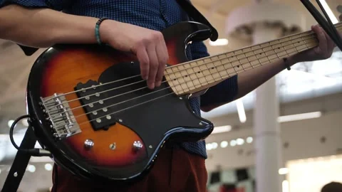 Close up man playing red electric guitar. Video stock 237702774