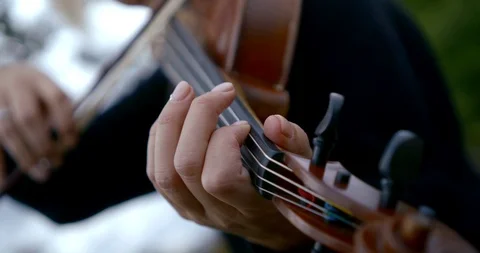Close - up of a man playing the violin. He fingers the strings. Stock Footage 116451409