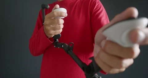 Close-up. Man playing Virtual Reality shooters game with gun stock. Stock Footage 278992557