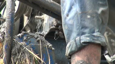 Close up of a man with a plough machine in rice field China Stock Footage