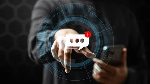 Close up of a man pointing at a glowing digital message notification icon o.. Stock Photos