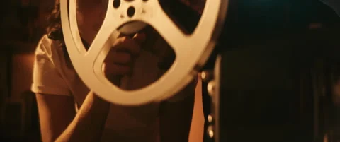 Close up of man pointing at vintage projector Video stock 202262337