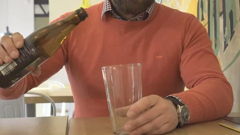 Close up, man pouring beer mug, glass, in cafe, indoor, steadycam 库存影片 73230316
