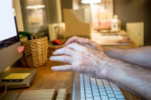 Close-up of a man praying with the typical hands gesture in front of the scre Stock Photos
