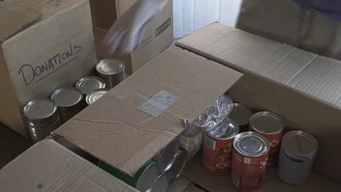 Close-up of a Man preparing box of donations Stock-Footage 128780340