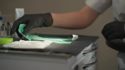 Close up of man preparing dental instruments with gloves on orthodontic medical Stock Footage 345071982