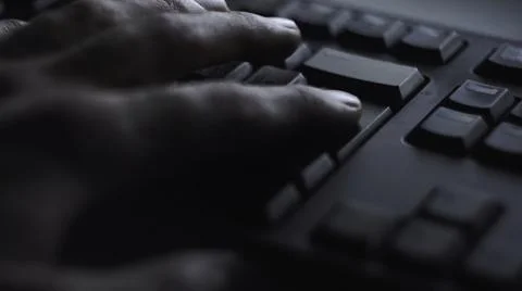 Close-up man presses keyboard key. Man presses button enter computer keyboard Foto stock