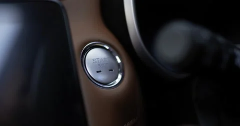 Close up of Man presses start button in car motor. Turning on functioning  Video stock 170984570