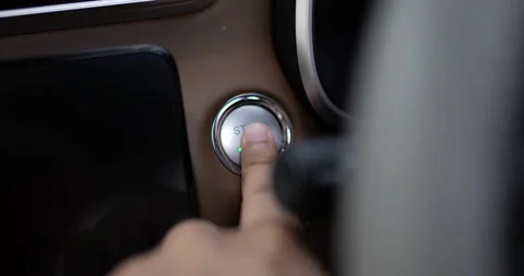 Close up of Man presses start button in car motor. Turning on functioning  Video stock 170984623