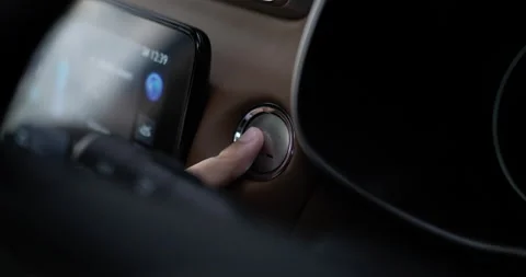 Close up of Man presses start button in car motor. Turning on functioning 動画素材 171805899