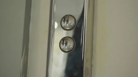 Close-up of man pressing elevator button. HDR. Reflection of man in elevator Video stock 235613617