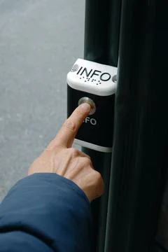Close-up of a man pressing an information button Stock Photos