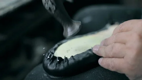 Close-up of a man producing shoes Stock Footage 87479395