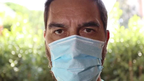Close-up of a man with protective mask looking straight ahead. Stock Footage 140208227