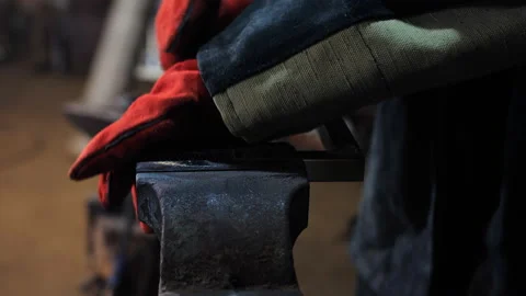 Close-up of a man pulling an angular profile into a vise. Stock Footage 206862427