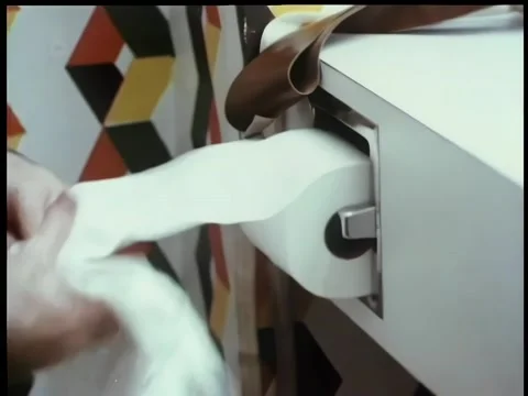 Close-up  man pulling out a large amount of toilet paper Stock Footage 260247453