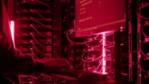 Close up of a man punching the keypad on a computer in a server room with Stock Footage 287413625