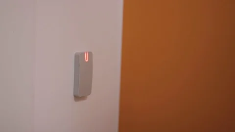 Close-up - the man put the card on checkpoint and open a door in building Stock Footage 126265578