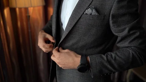 Close up, man puts on a vest, jacket Stock Footage 125253133